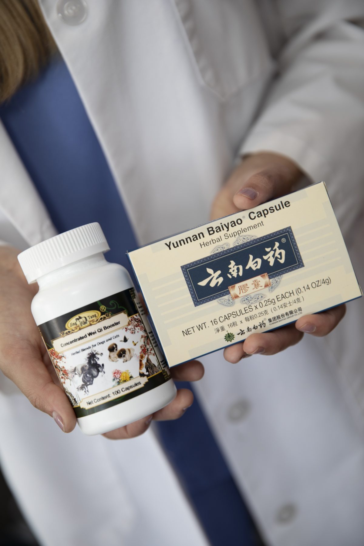 Vet holding Chinese herbal medicine products